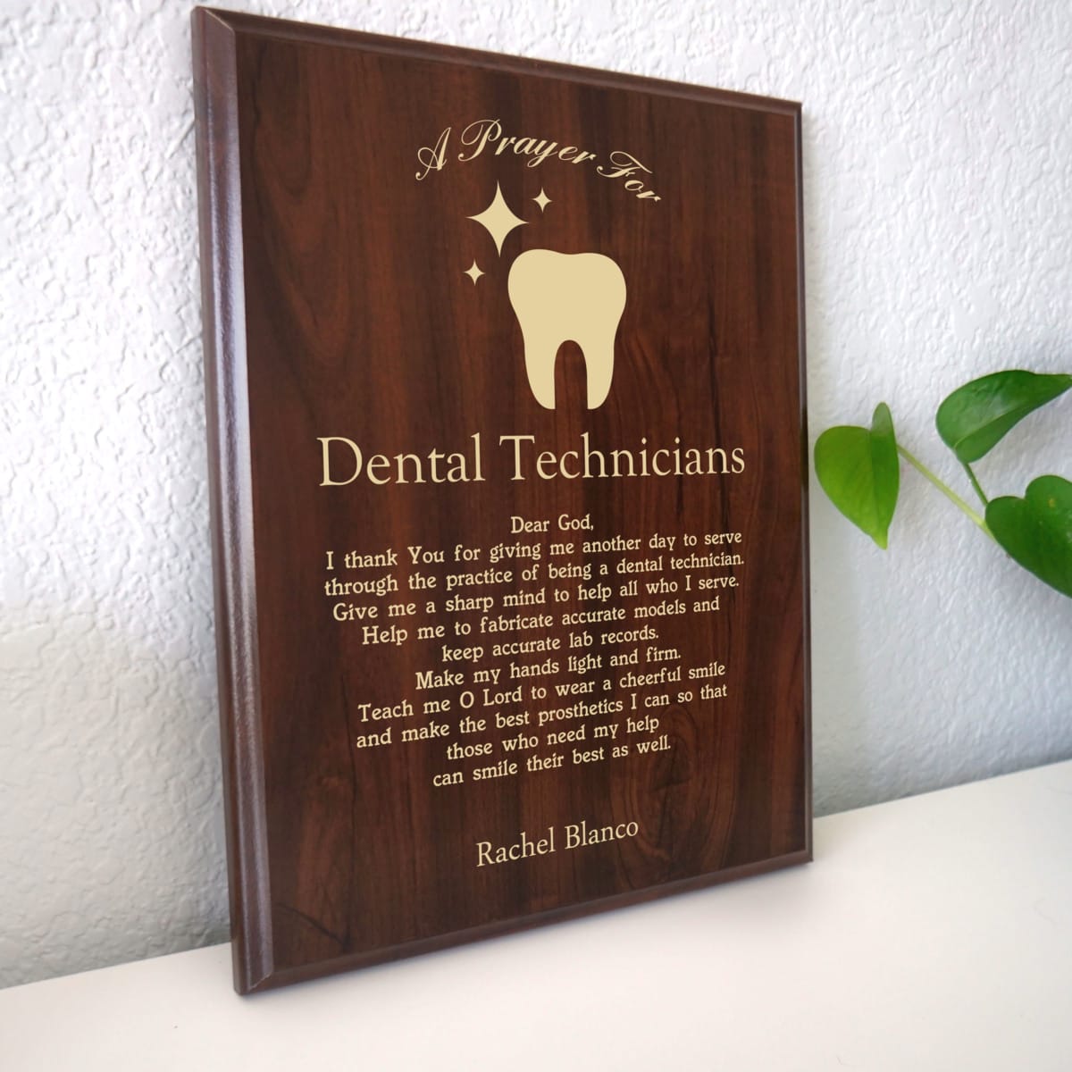 Photo of plaque resting on table at an angle.