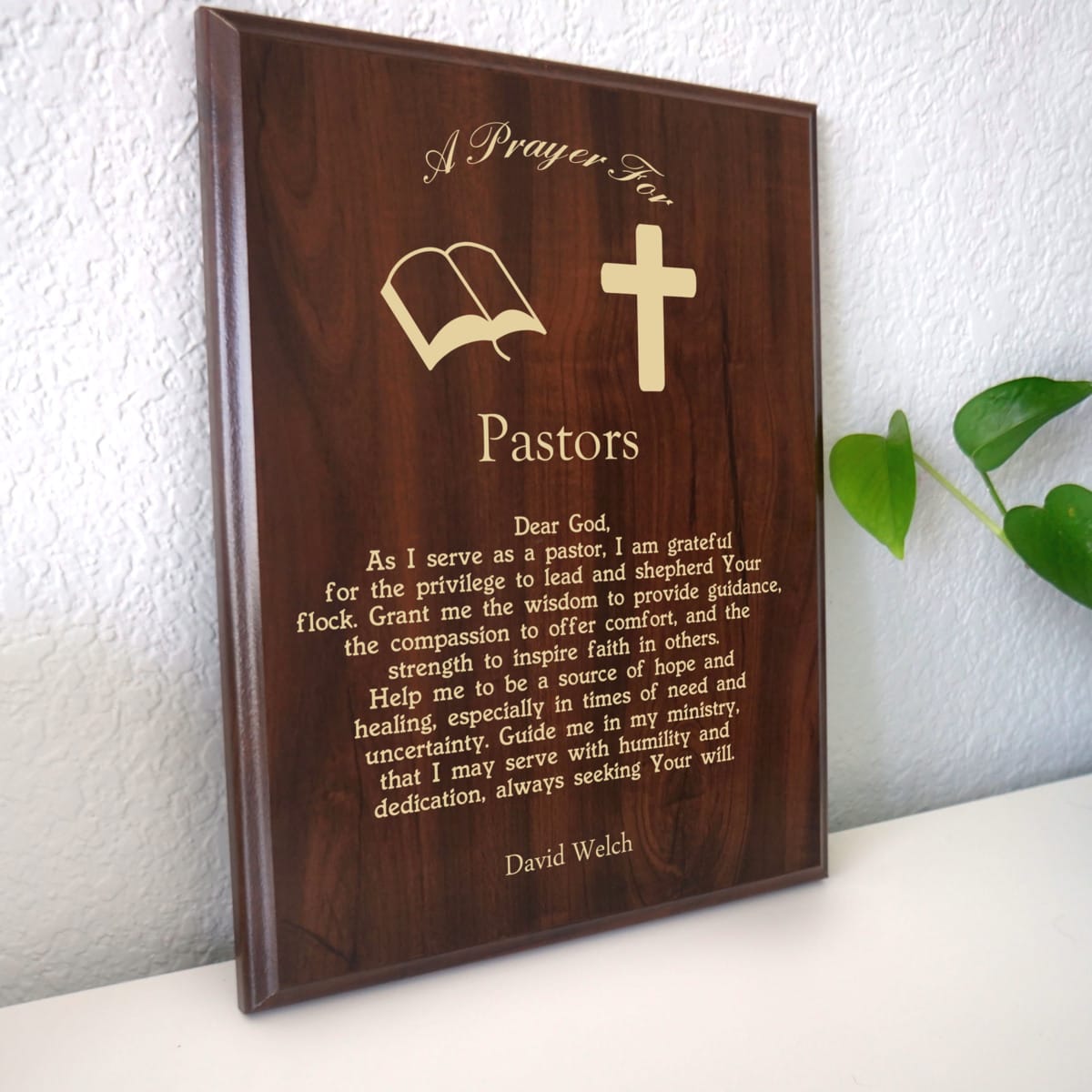 Photo of plaque resting on table at an angle.