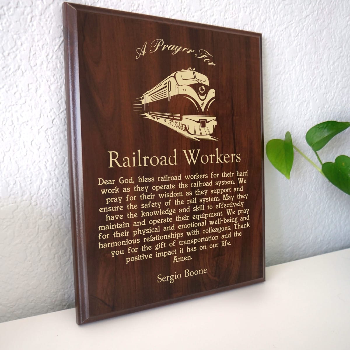 Photo of plaque resting on table at an angle.