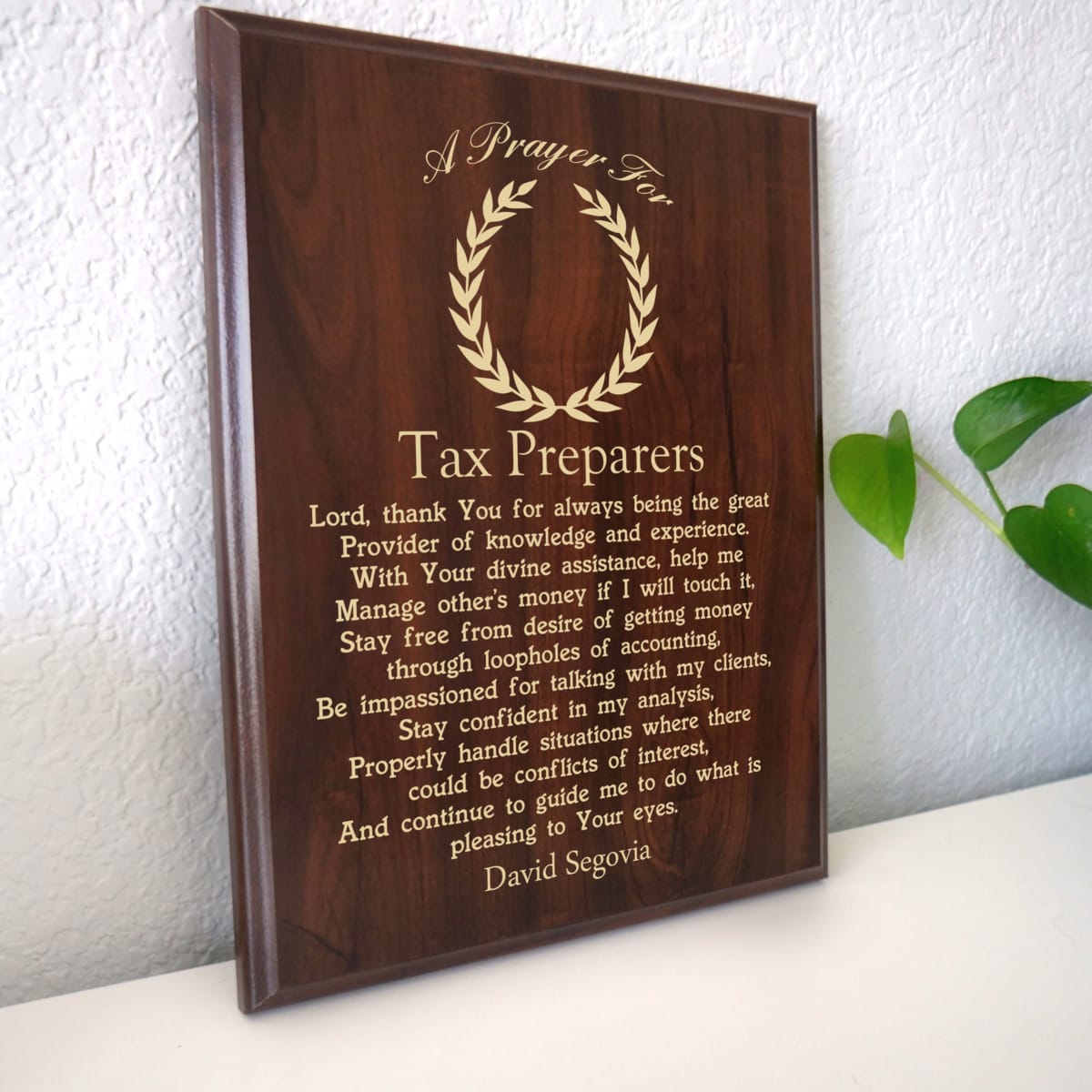 Photo of plaque resting on table at an angle.