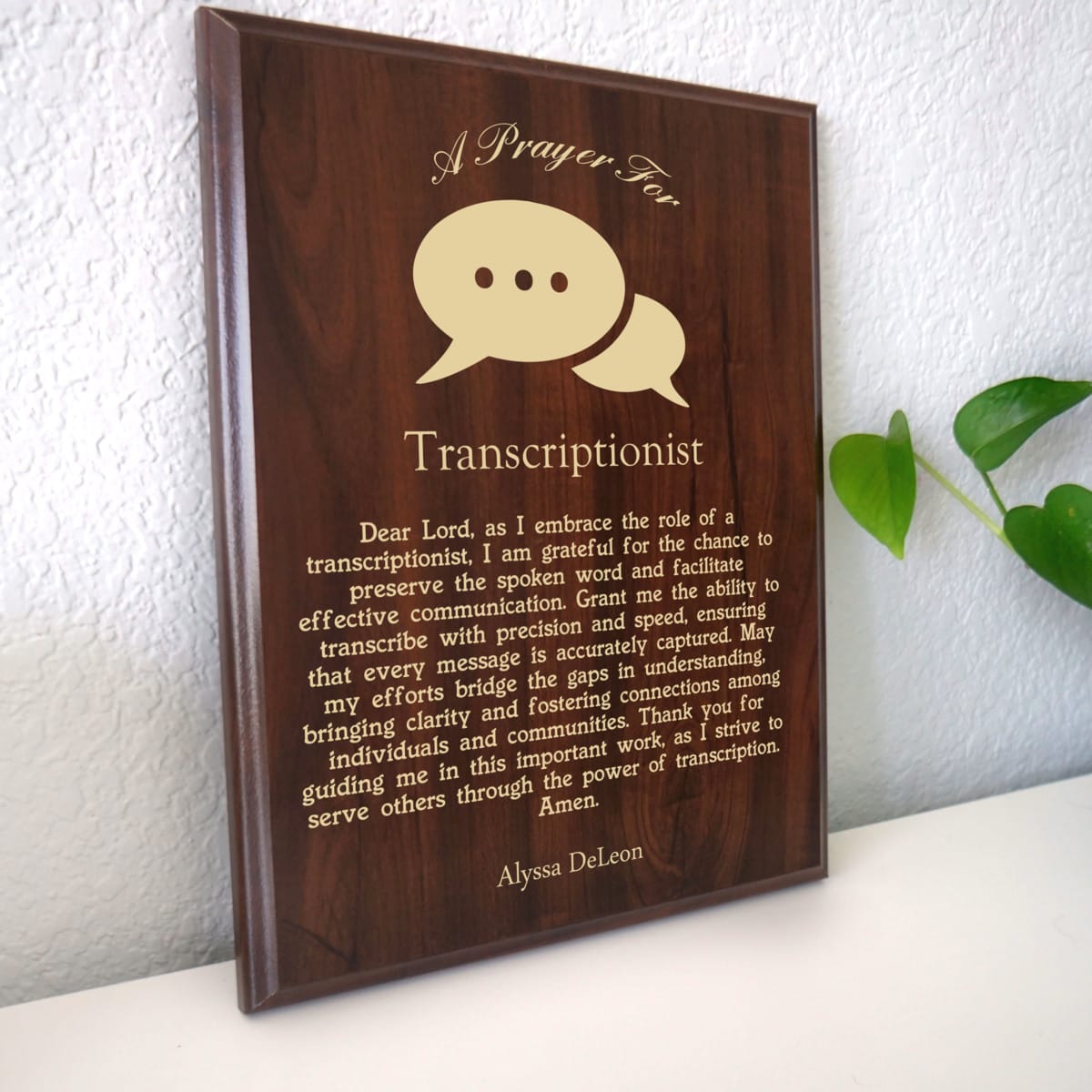 Photo of plaque resting on table at an angle.
