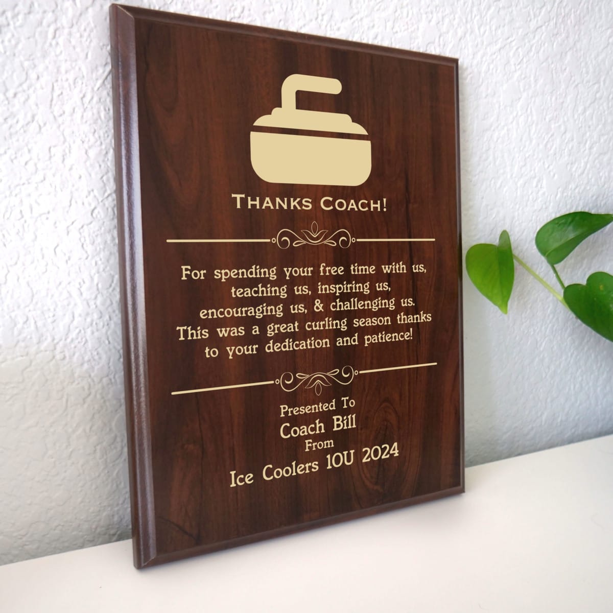 Photo of plaque resting on table at an angle.