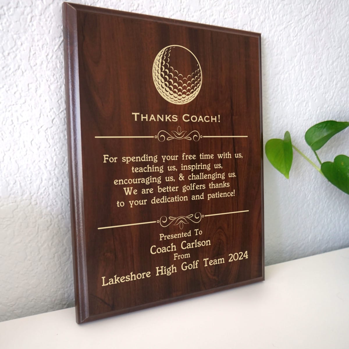 Photo of plaque resting on table at an angle.