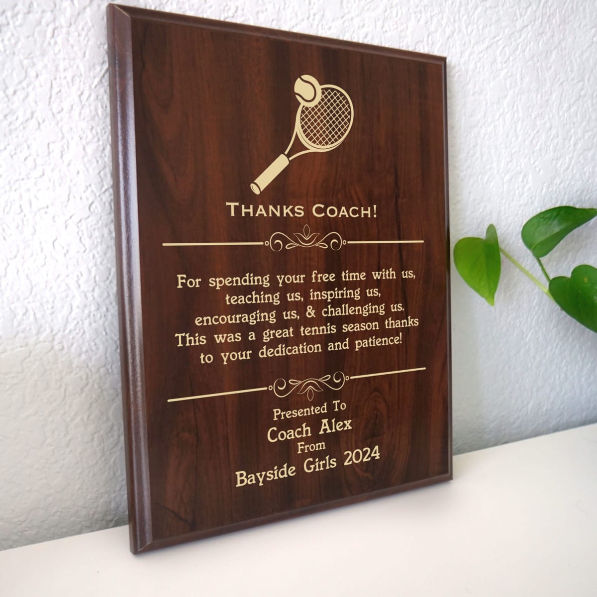 Photo of plaque resting on table at an angle.