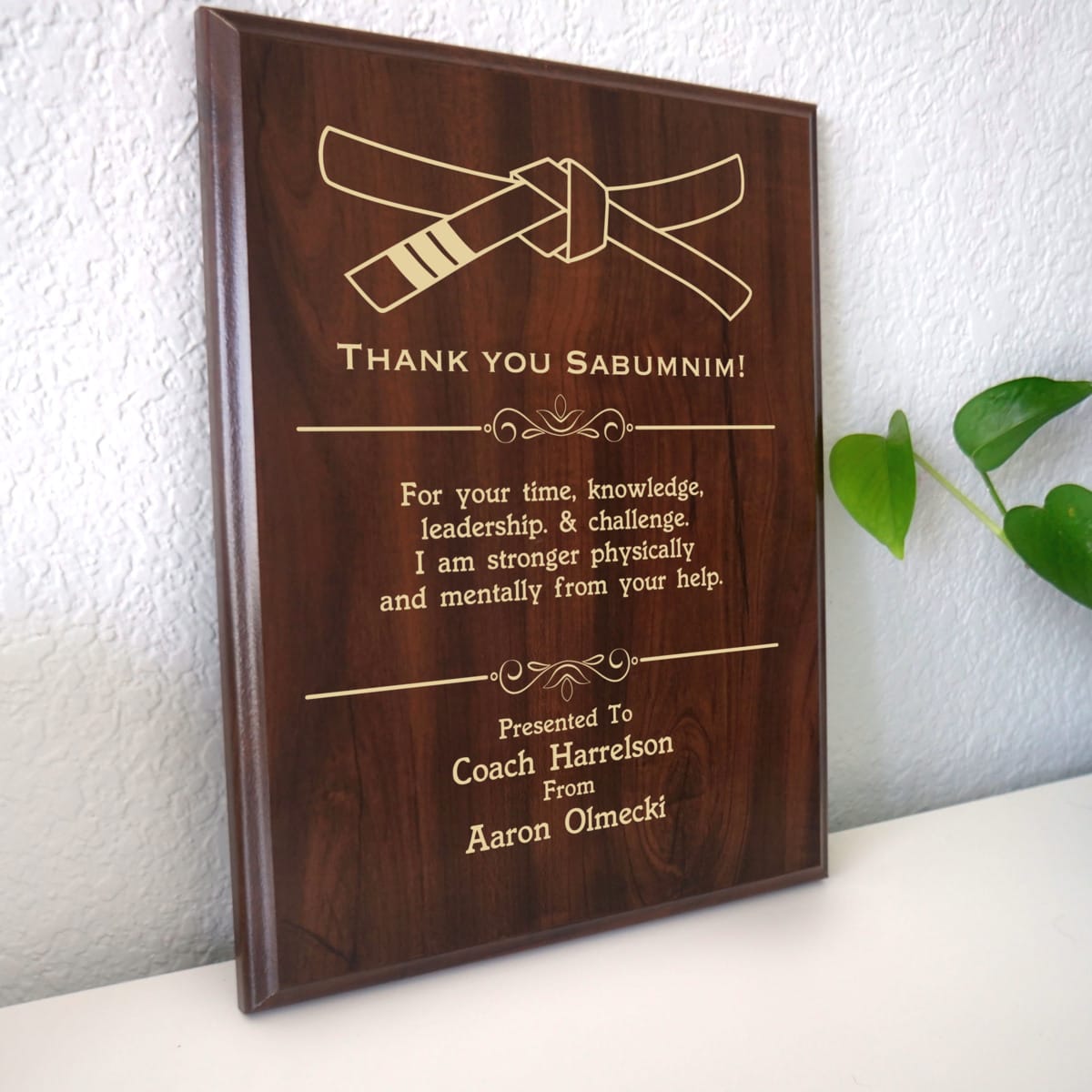 Photo of plaque resting on table at an angle.