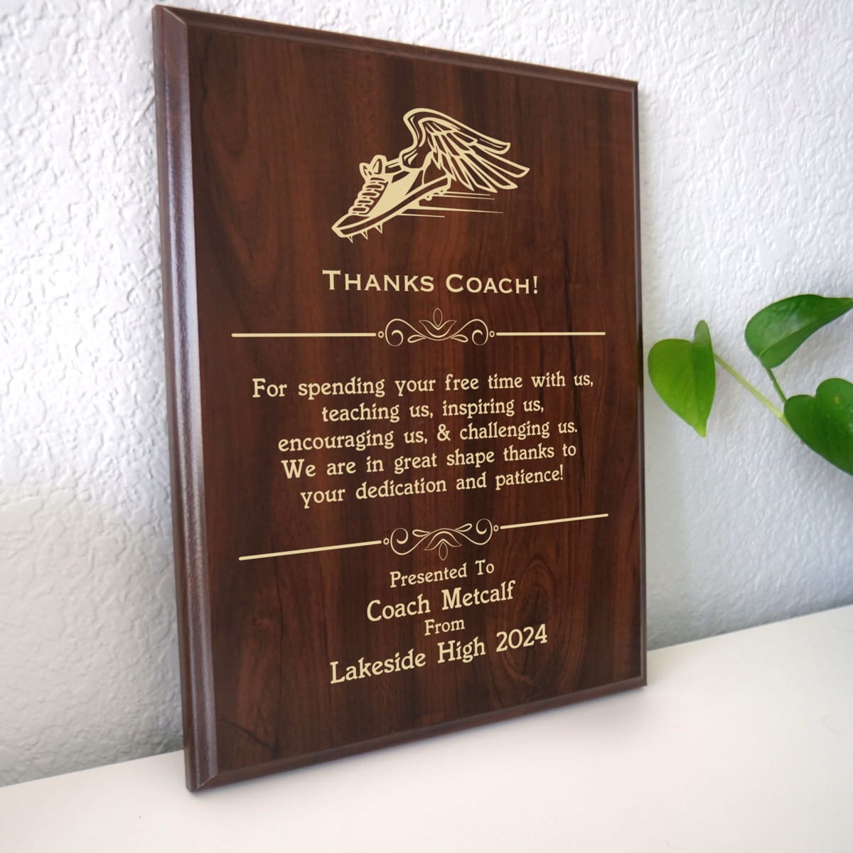 Photo of plaque resting on table at an angle.