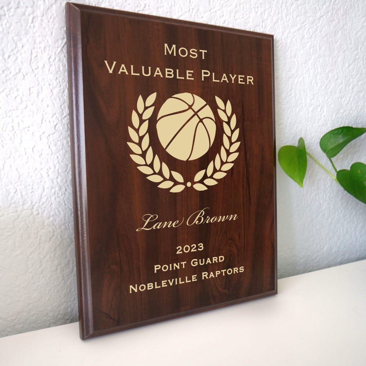 Photo of plaque resting on table at an angle.