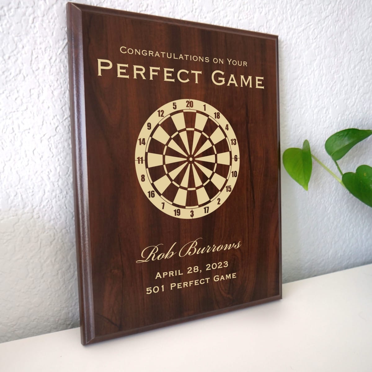 Photo of plaque resting on table at an angle.