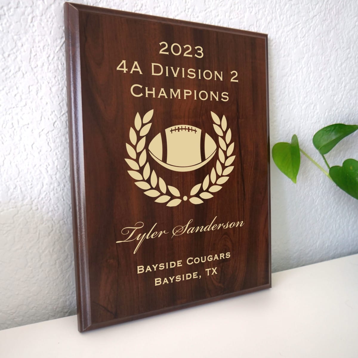 Photo of plaque resting on table at an angle.