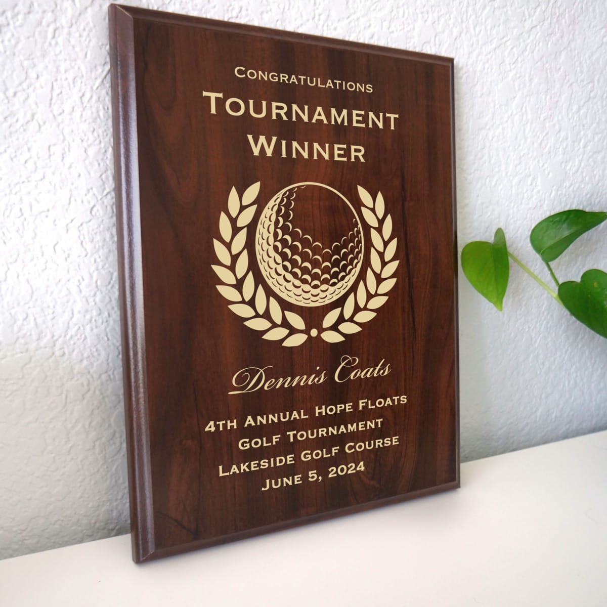 Photo of plaque resting on table at an angle.