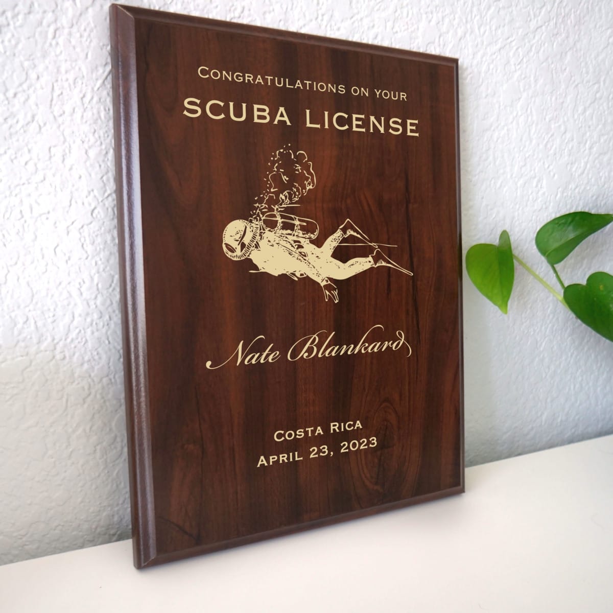 Photo of plaque resting on table at an angle.