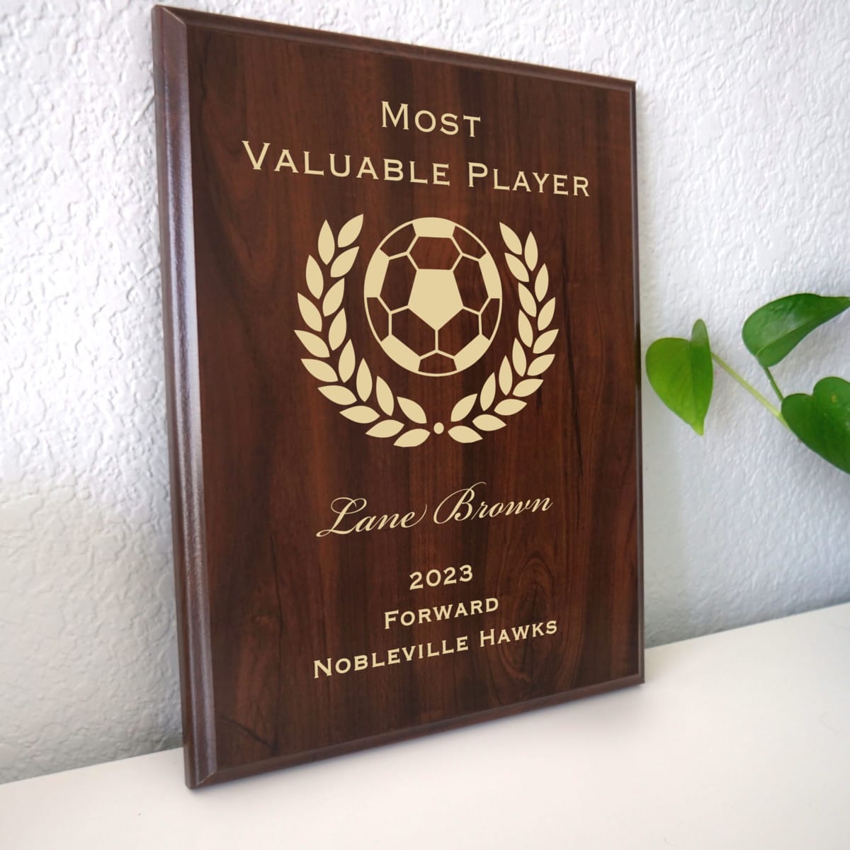 Photo of plaque resting on table at an angle.