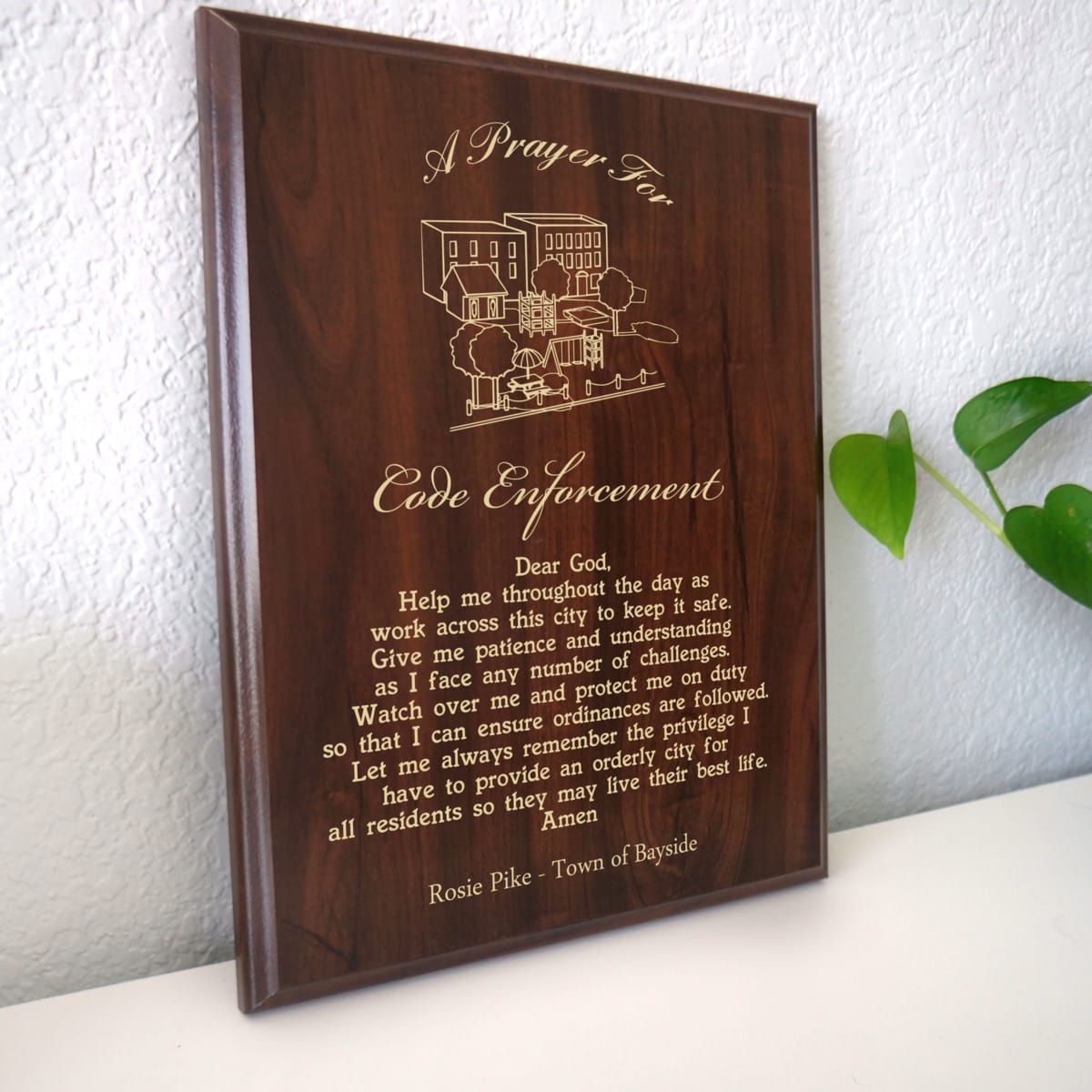 Photo of plaque resting on table at an angle.