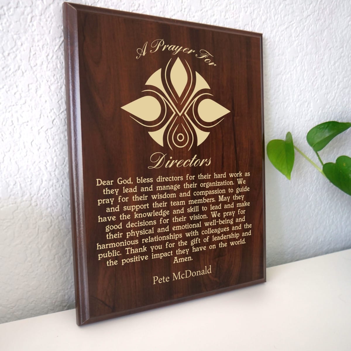 Photo of plaque resting on table at an angle.