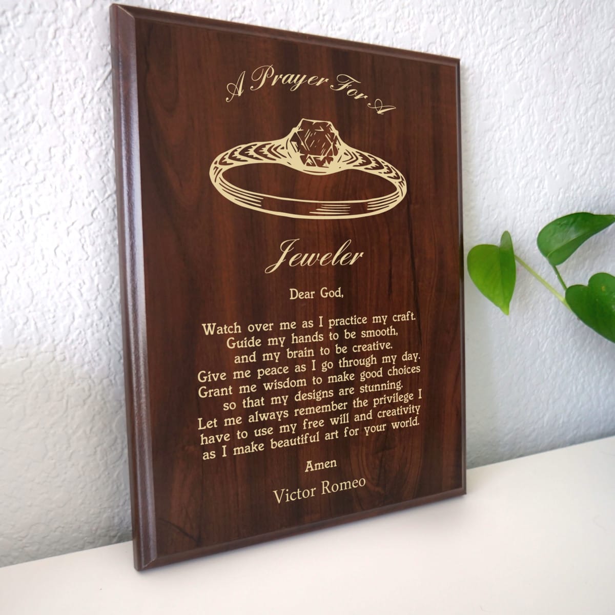 Photo of plaque resting on table at an angle.