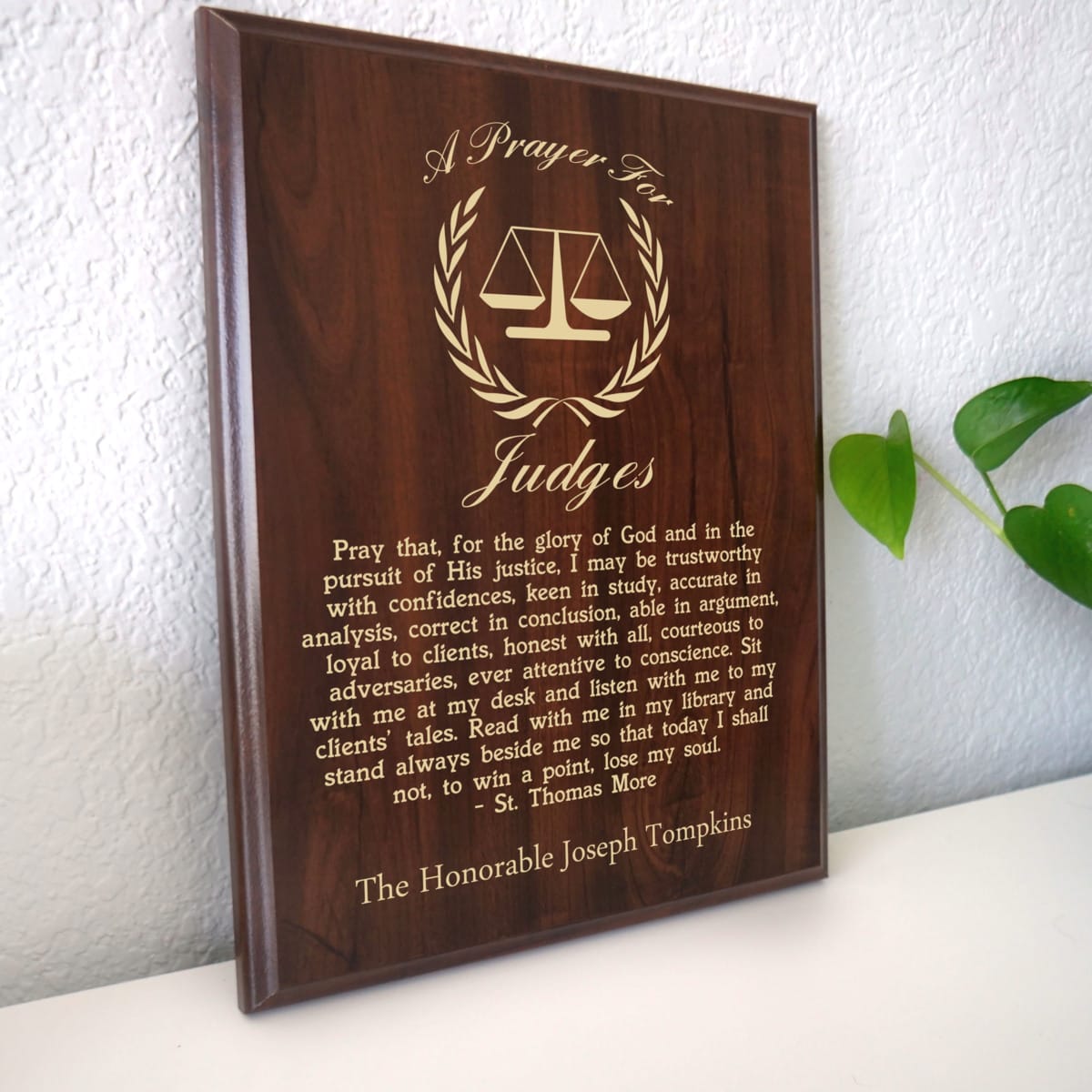 Photo of plaque resting on table at an angle.