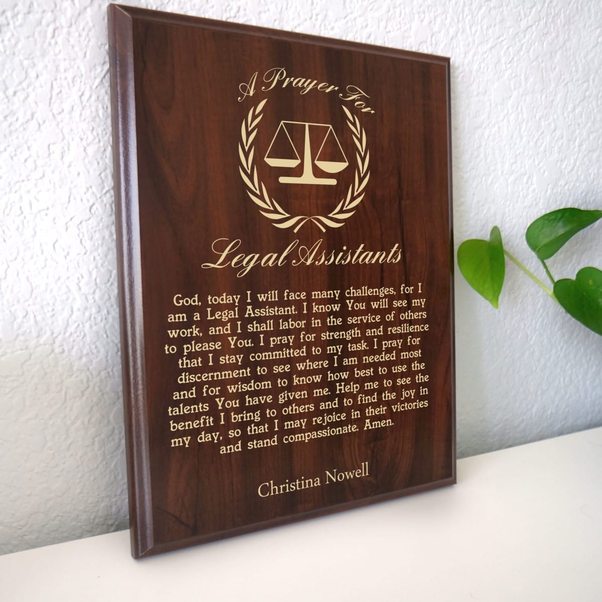 Photo of plaque resting on table at an angle.