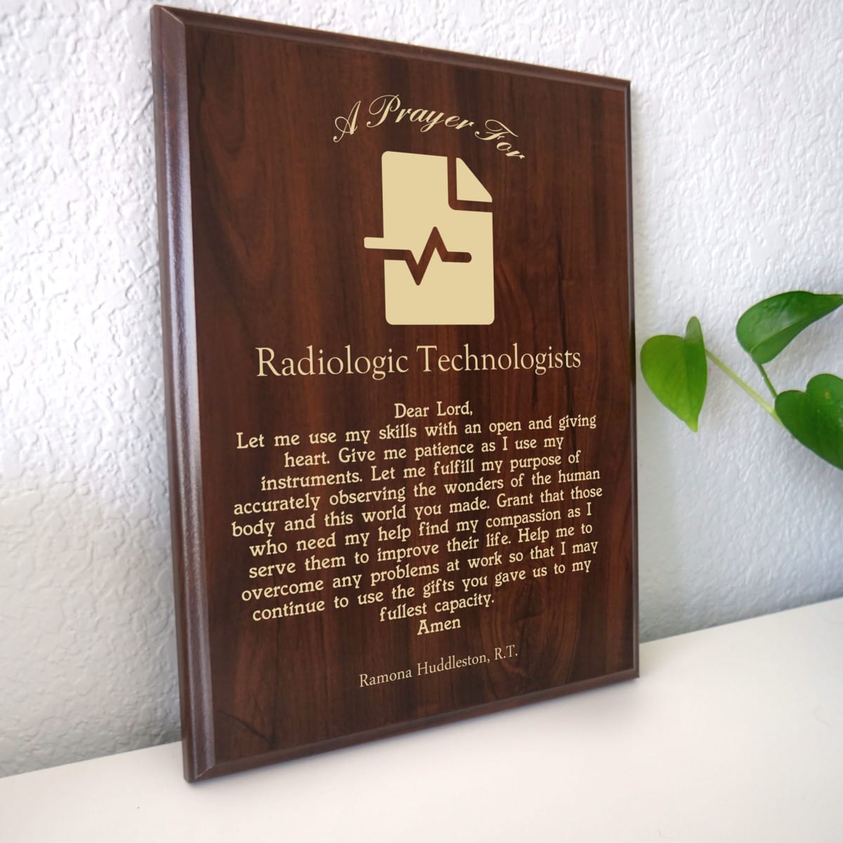 Photo of plaque resting on table at an angle.