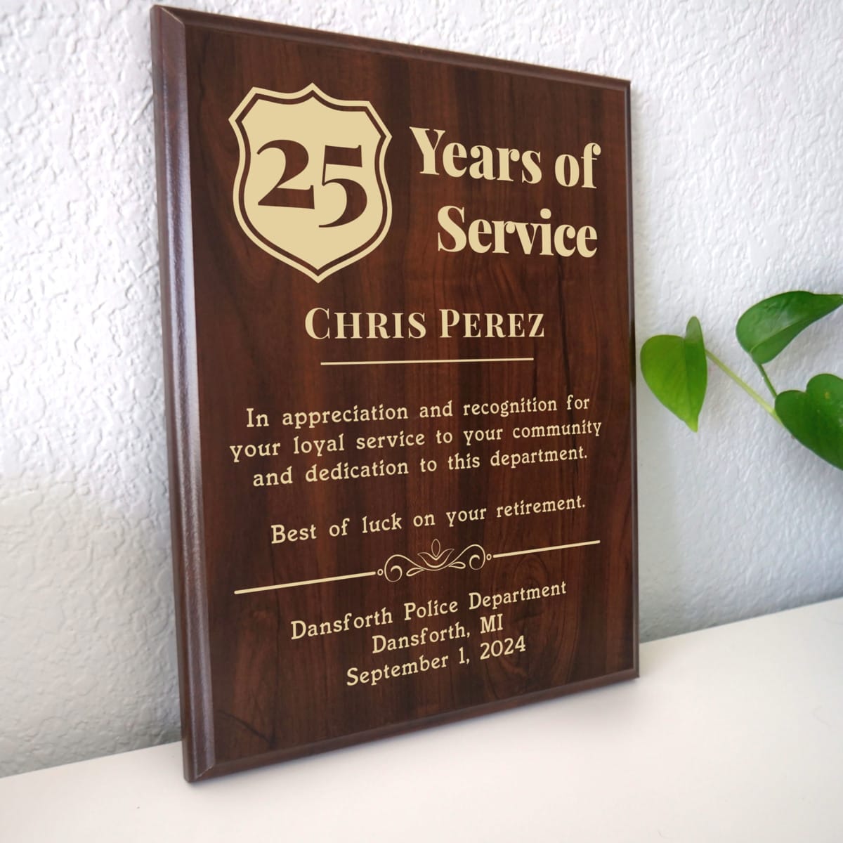 Photo of plaque resting on table at an angle.