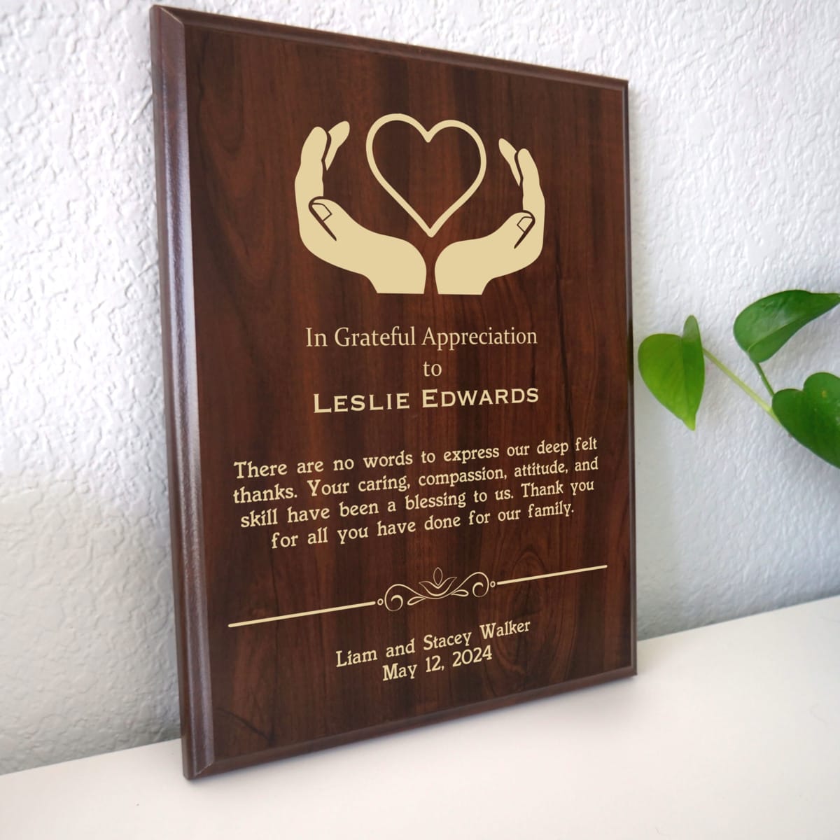 Photo of plaque resting on table at an angle.