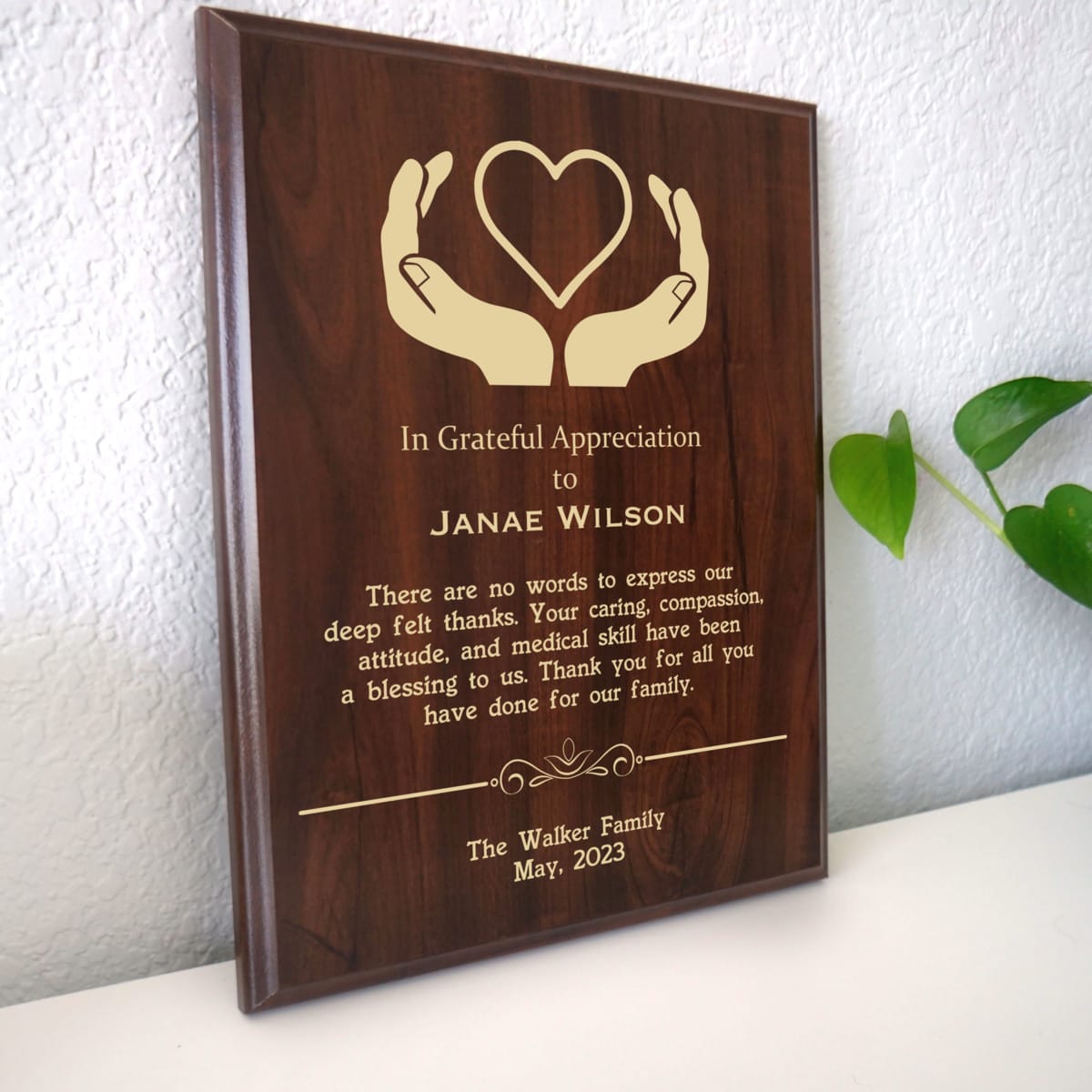 Photo of plaque resting on table at an angle.