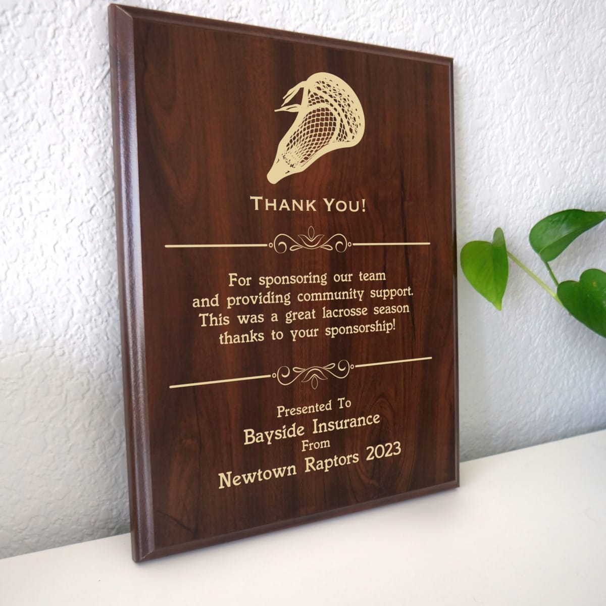 Photo of plaque resting on table at an angle.