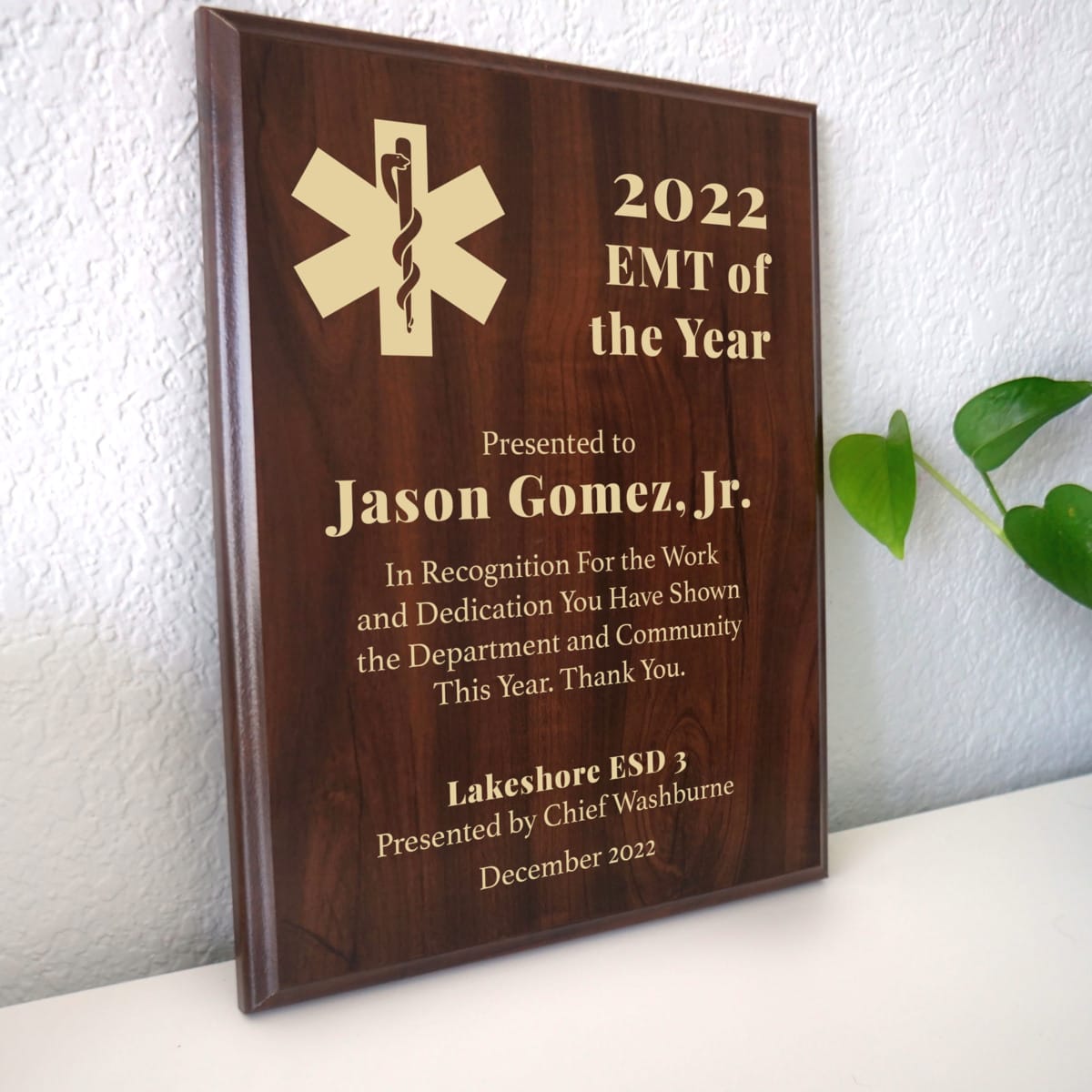 Photo of plaque resting on table at an angle.