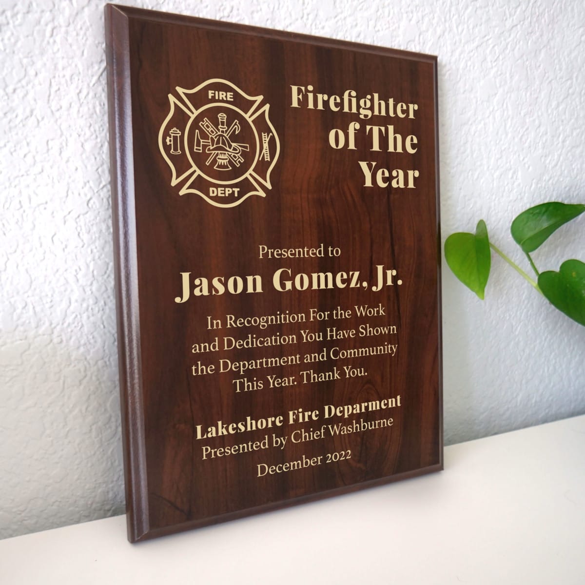 Photo of plaque resting on table at an angle.