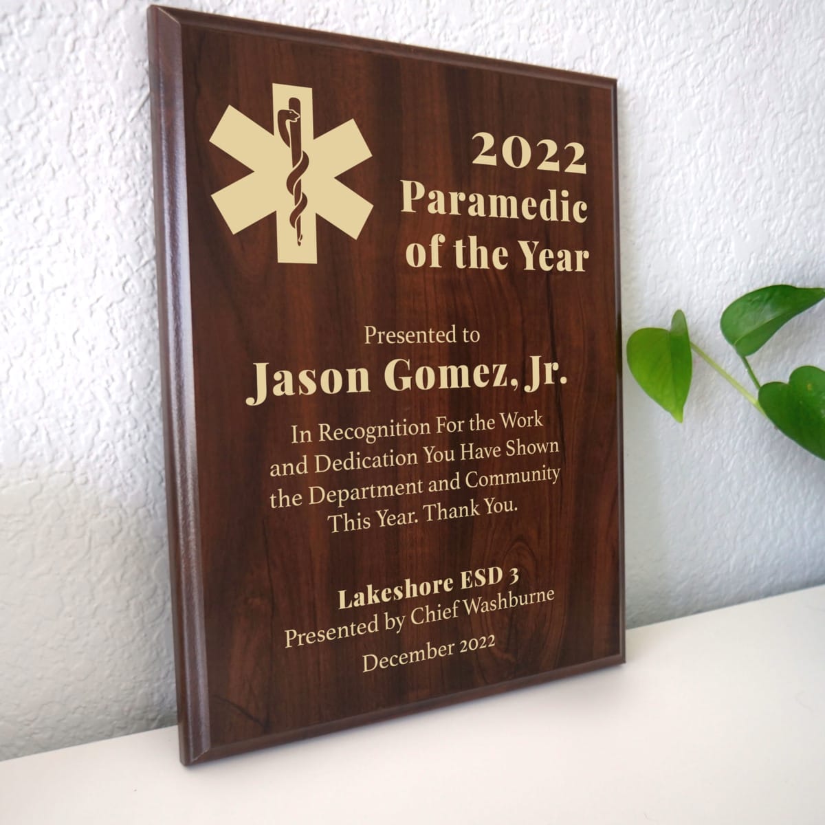 Photo of plaque resting on table at an angle.