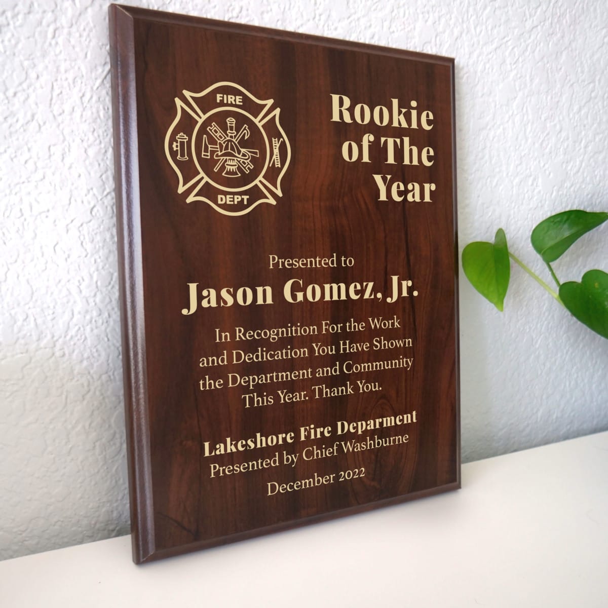 Photo of plaque resting on table at an angle.