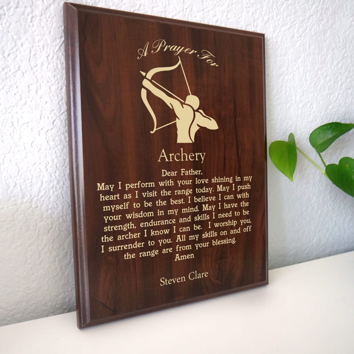 Photo of plaque resting on table at an angle.