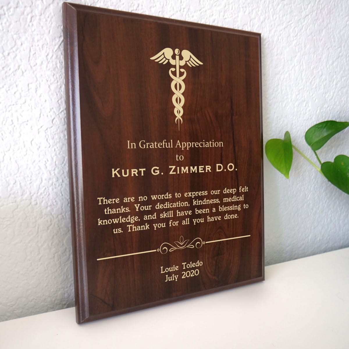 Photo of plaque resting on table at an angle.