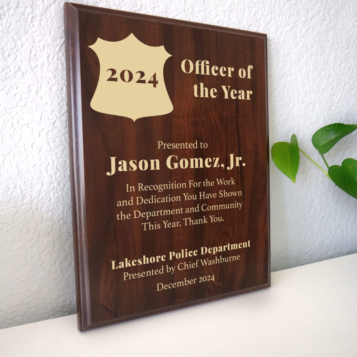 Photo of plaque resting on table at an angle.